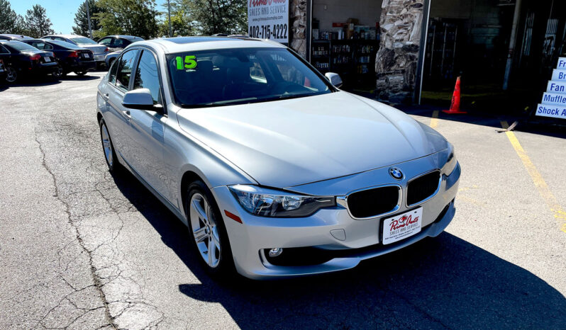 2015 BMW 320xi AWD silver sedan with aluminum alloy wheels and sunroof. Exterior view from front passenger corner.