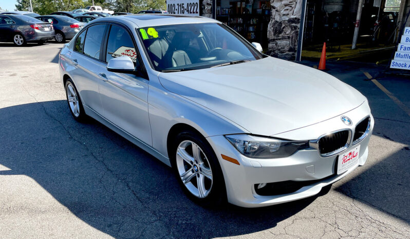 2014 BMW 320xi AWD silver sedan with aluminum alloy wheels and sunroof. Exterior view from front passenger corner.