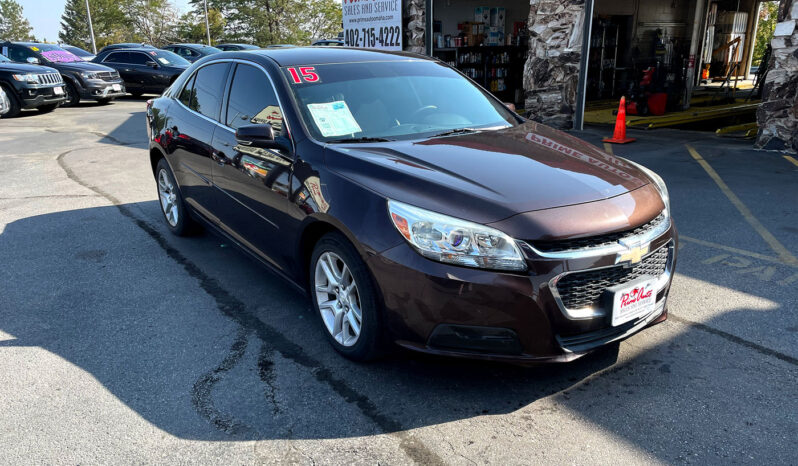 2015 Chevrolet Malibu LT Burnished Brandy Metallic with aluminum alloy wheels. Exterior view from front passenger corner.