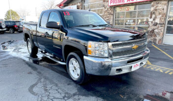 2013 Chevrolet Silverado 1500 LT extended cab 4X4 Black with Aluminum/Alloy wheels, chrome accents, side step. Exterior view from the front passenger corner.